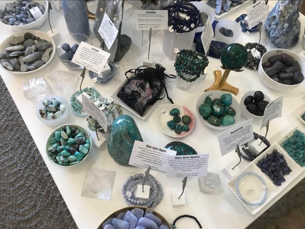 Display table of turquoise, aquamarine and blue lace agate crystals