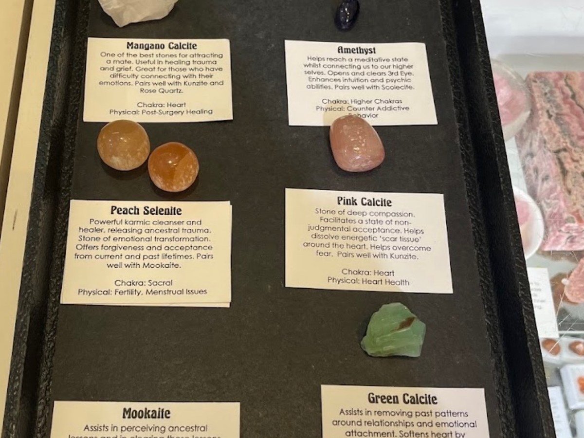Tray of calcite, amethyst and mookaite stones with handwritten chakra cards